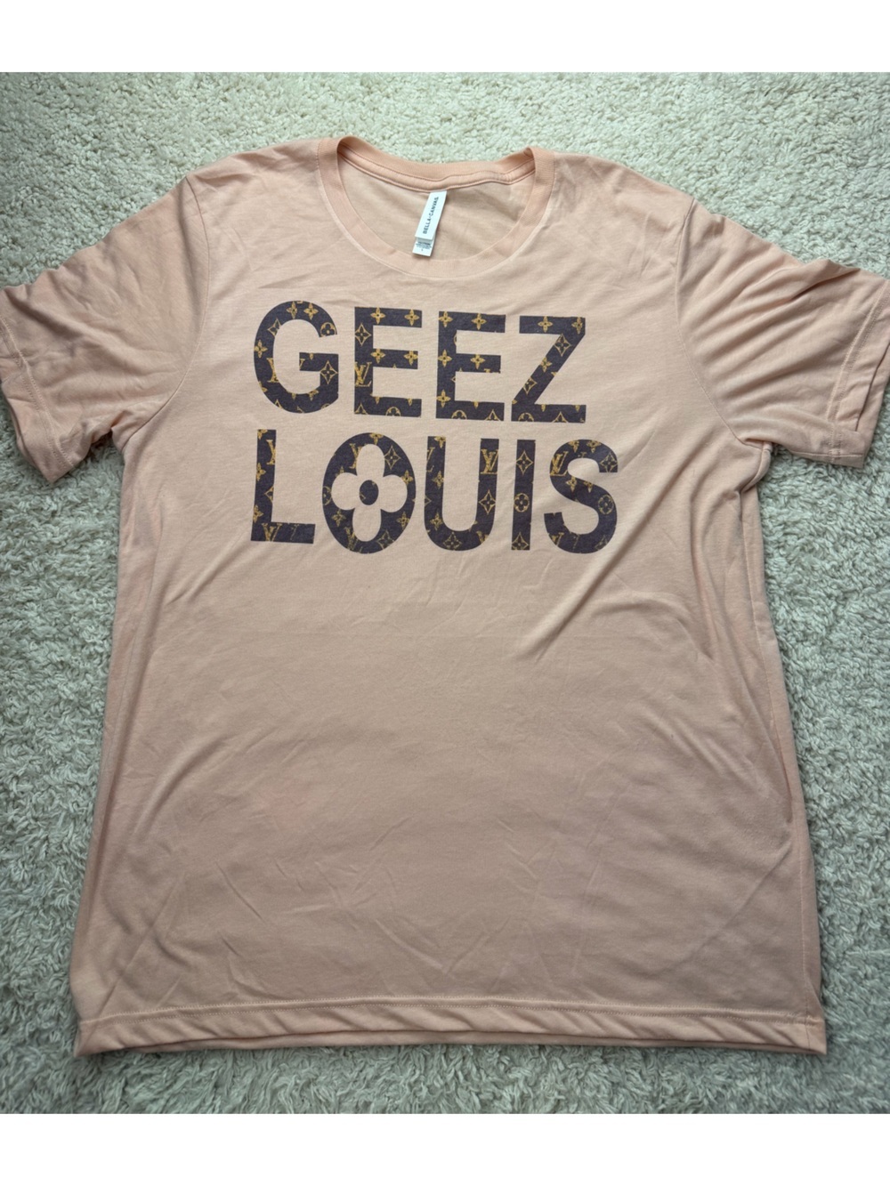 Large Graphic Tee with 'GEEZ LOUIS' Text